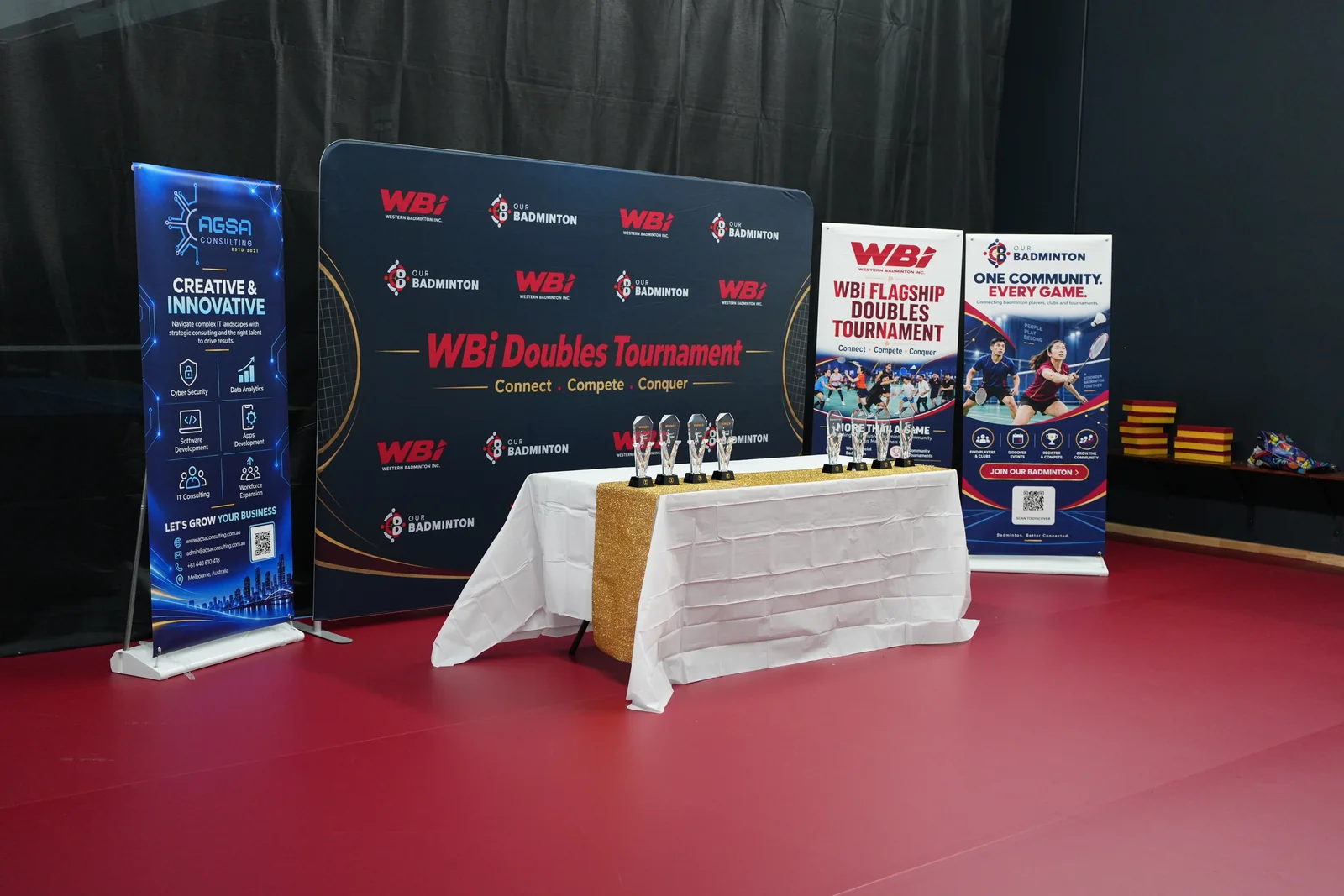 The trophy table and WBi presentation backdrop prepared for the tournament