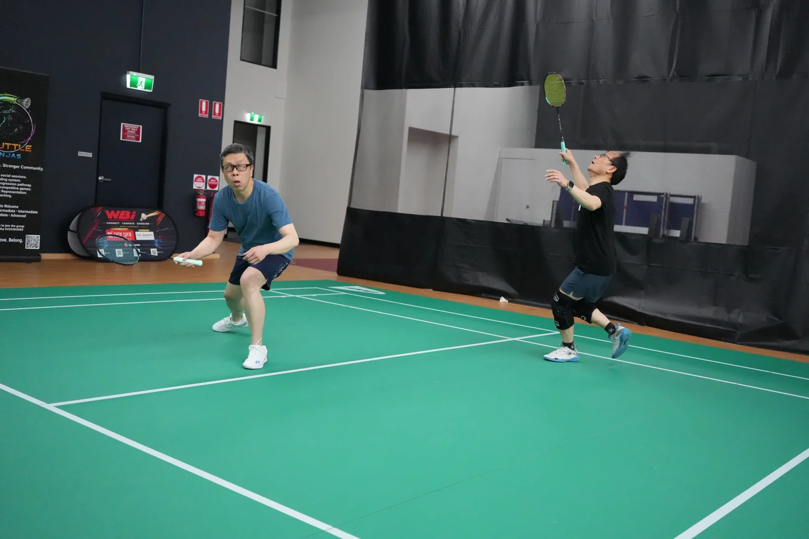 Two doubles players preparing for the next shot at the WBi 2026 tournament